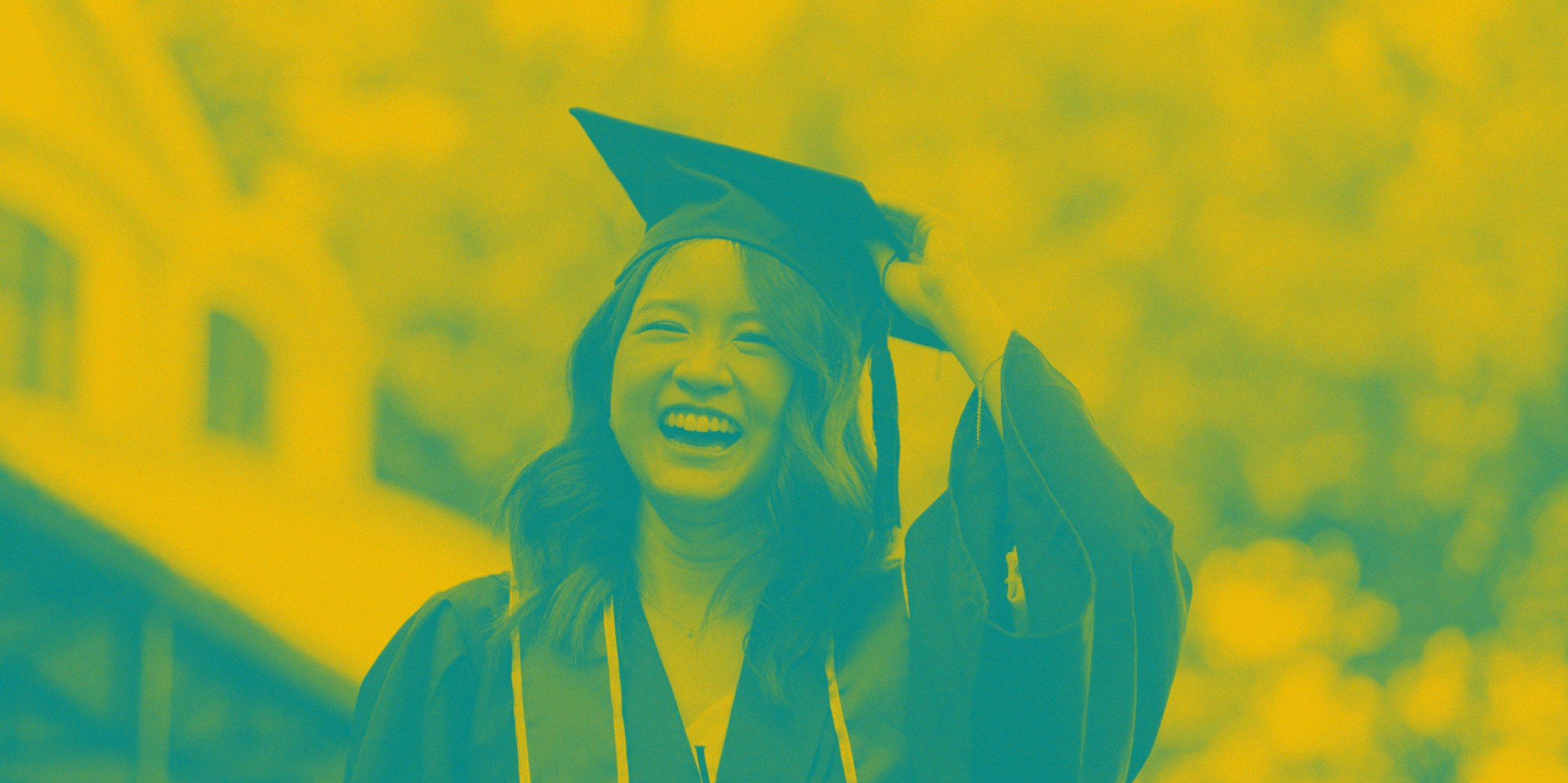 Duotone image of a high school graduate in cap and gown, smiling.